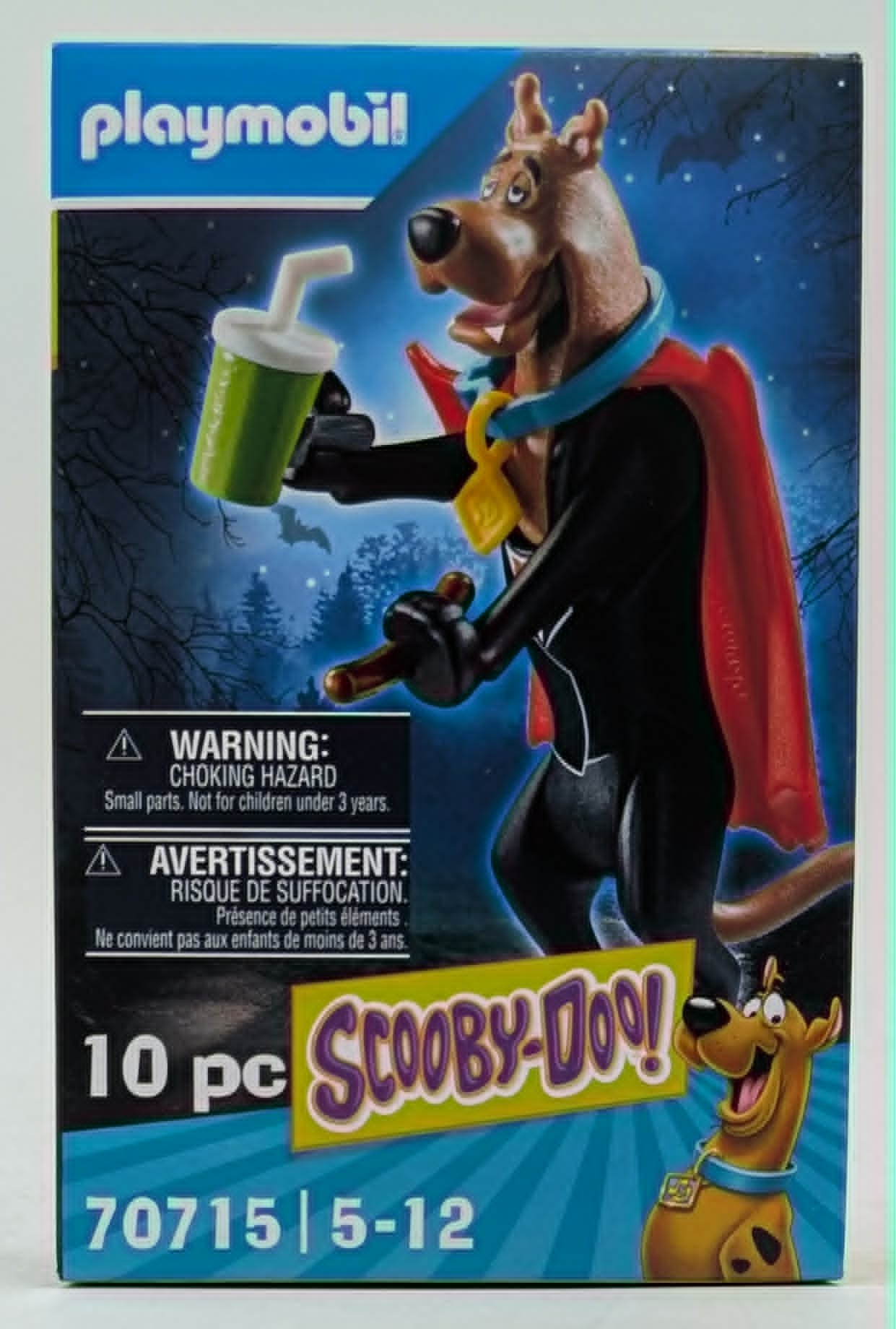 Scatola Playmobil Scooby-Doo! con cane marrone, bicchiere verde e mantello rosso.