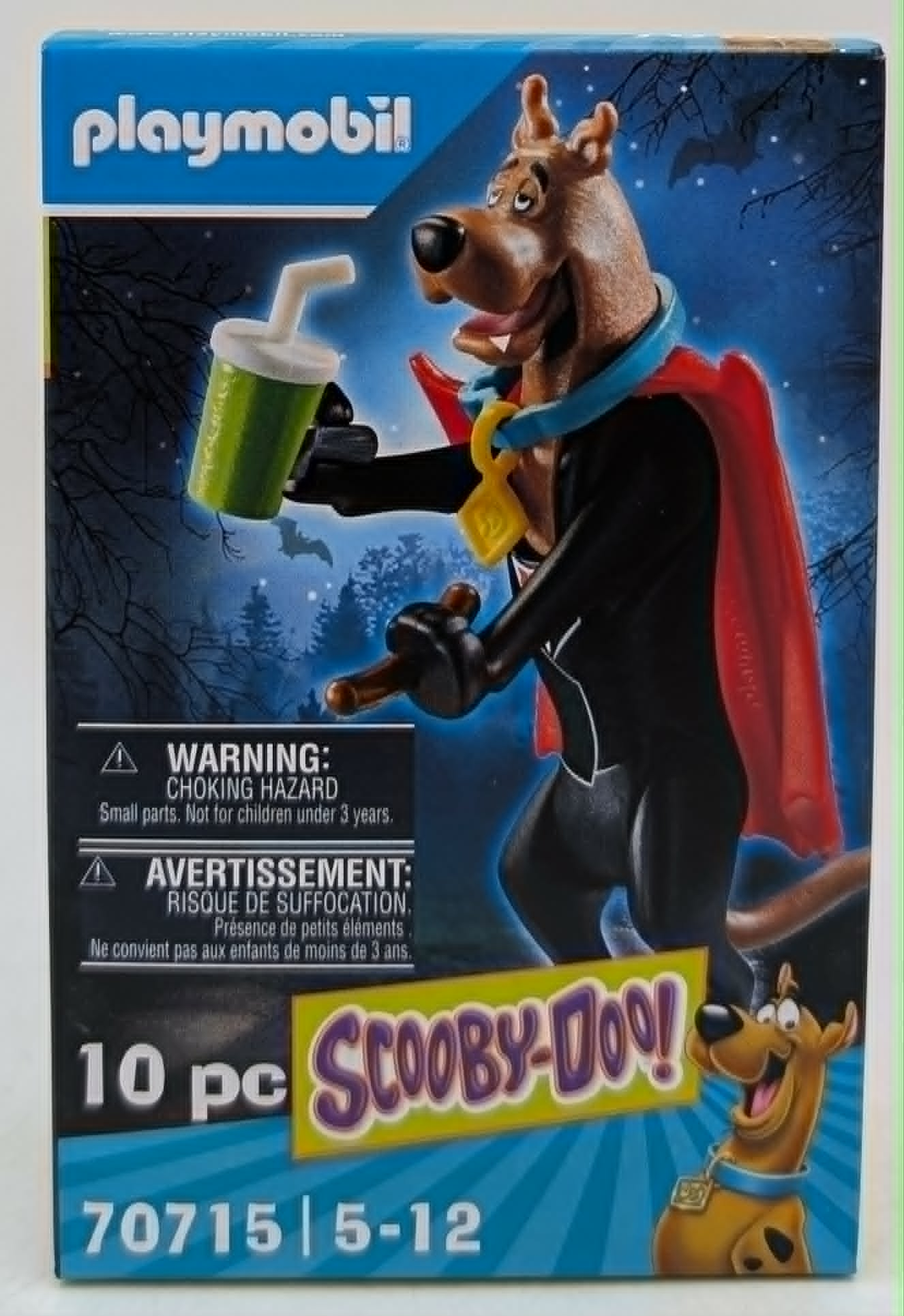 Scatola Playmobil Scooby-Doo! con figura e bevanda, alberi e pipistrelli sullo sfondo.