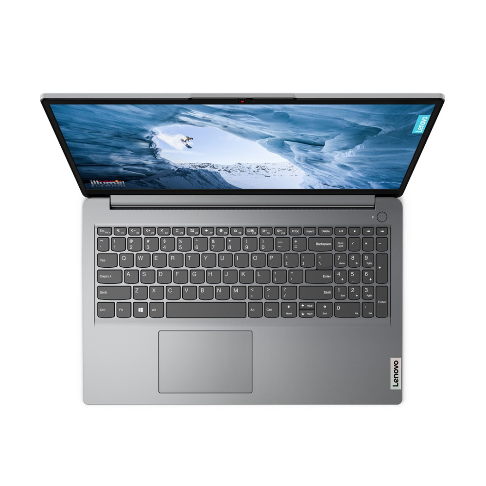Srebrny laptop Lenovo jest otwarty, pokazując klawiaturę i ekran z krajobrazem zaśnieżonych gór.