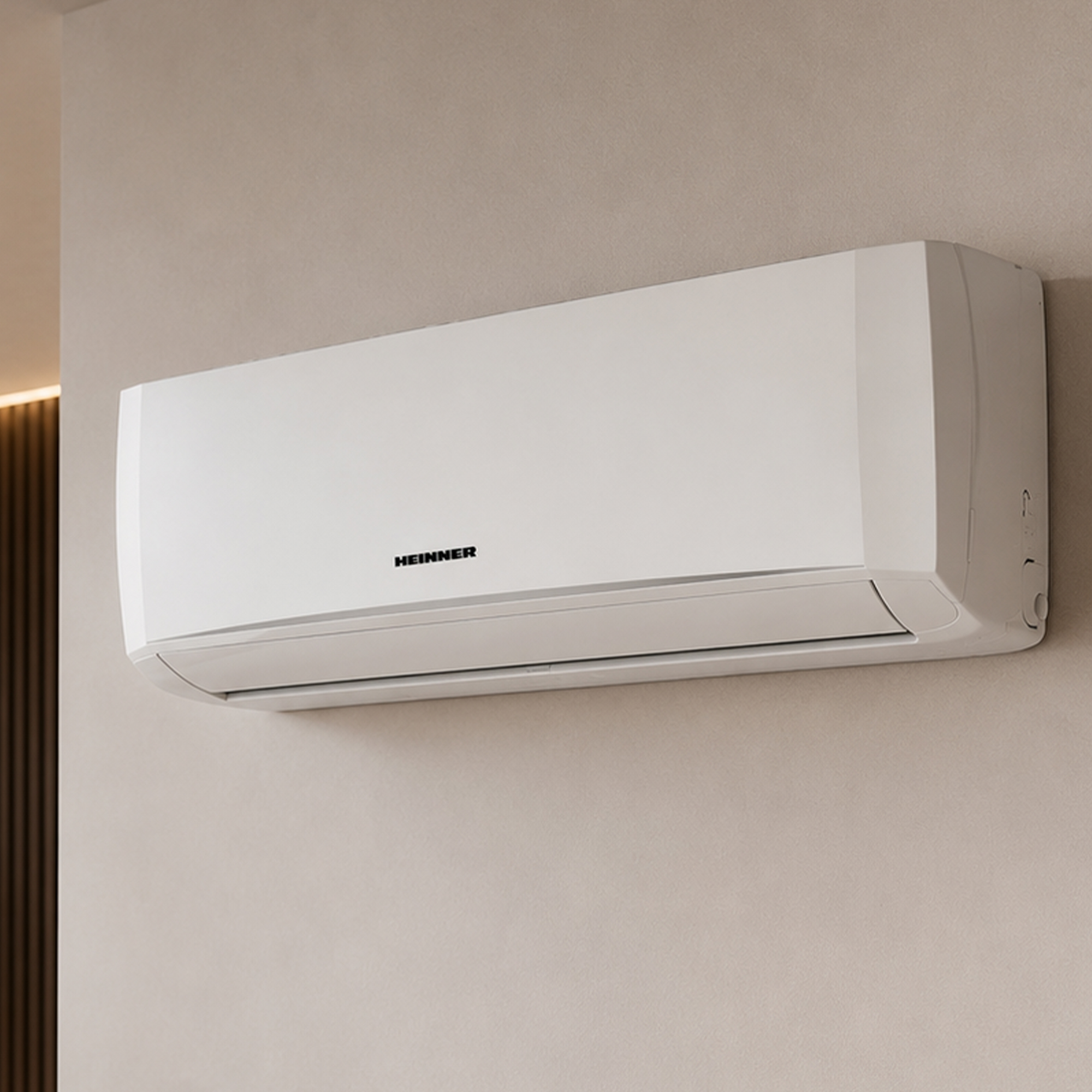 A white air conditioning unit is mounted on a beige wall.