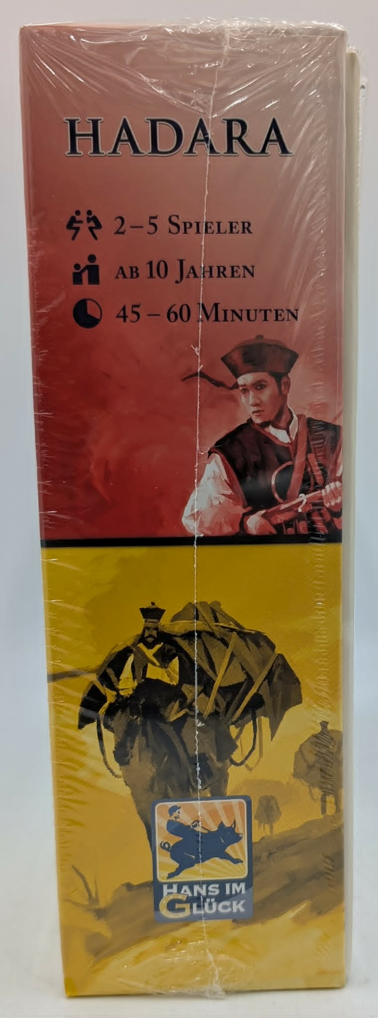 Brettspielbox mit Titel Hadara, Spieleranzahl, Alter und Spielzeit.