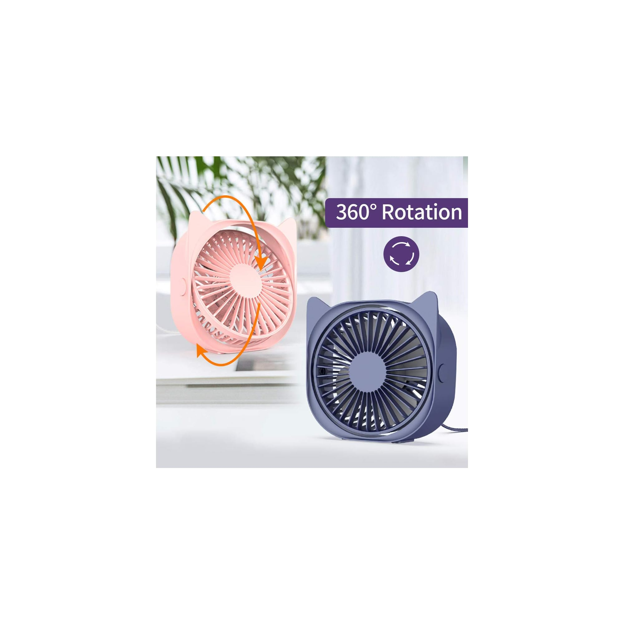 Zwei katzenförmige Ventilatoren, ein rosafarbener und ein blauer, auf einem Tisch.