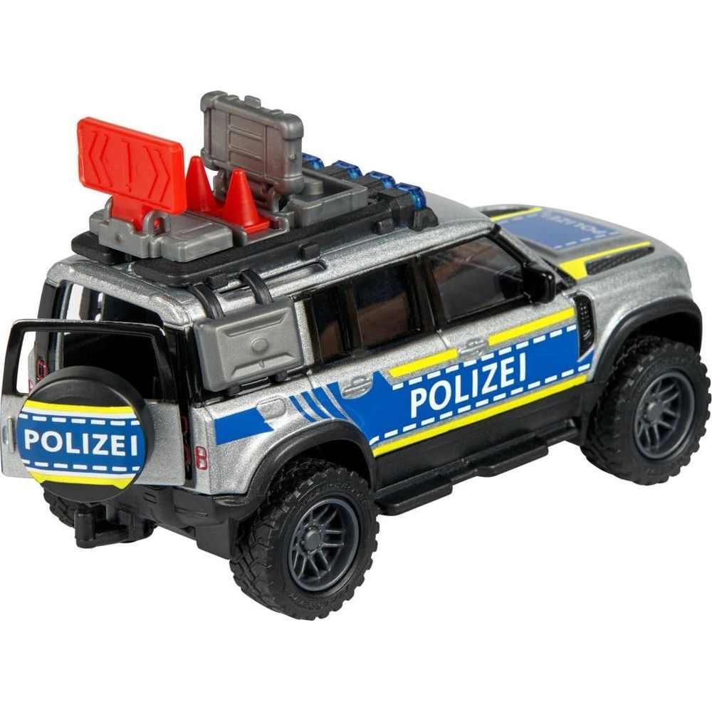 Silberner Spielzeug-Polizeiwagen mit blauen und gelben Streifen, Blaulicht und Reserverad.