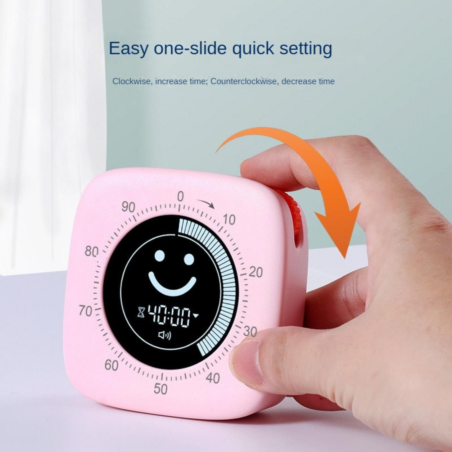 Ein pinker Timer mit einem Smiley und 40:00 Anzeige, der von einer Hand eingestellt wird.