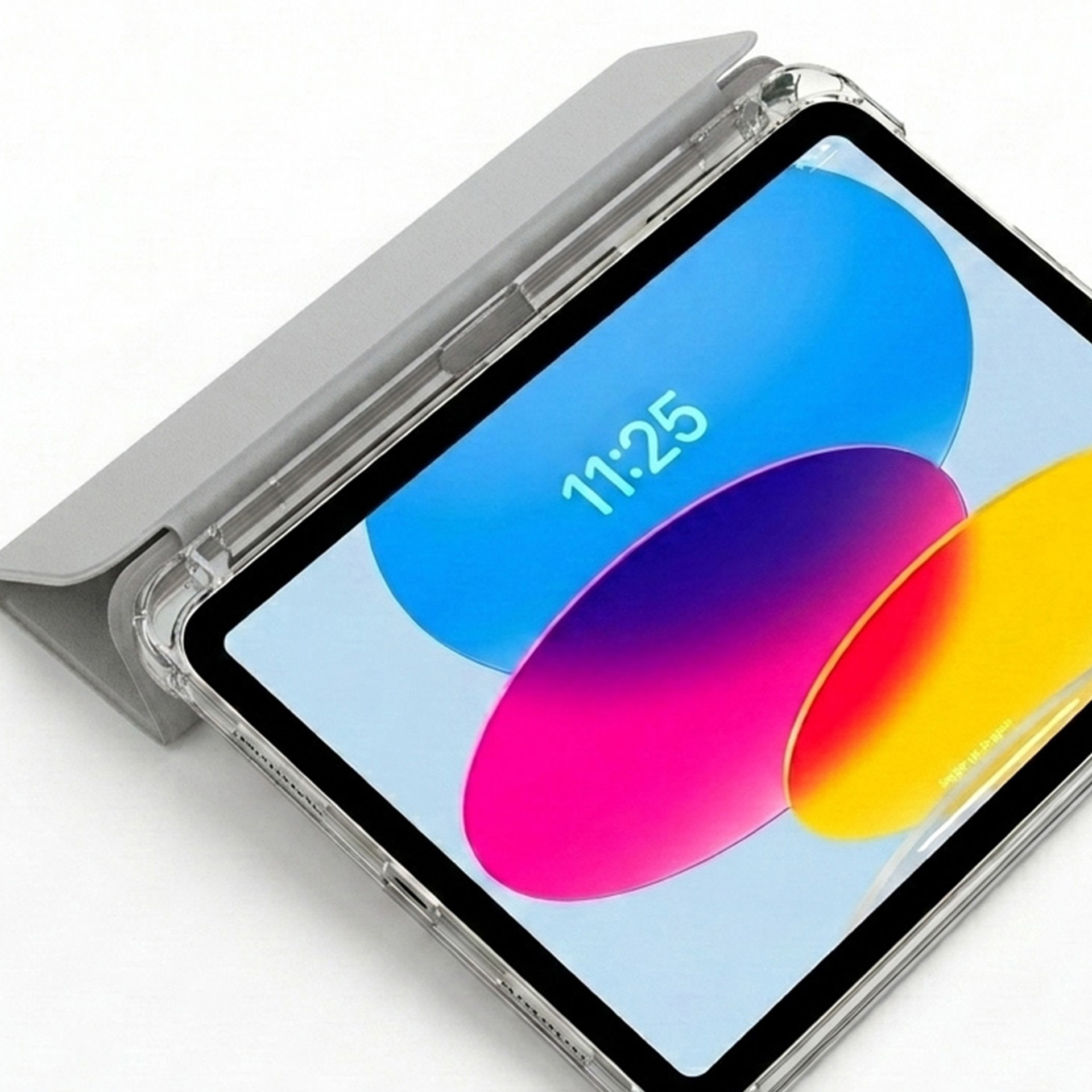 Szary tablet w etui ochronnym z kolorową tapetą.