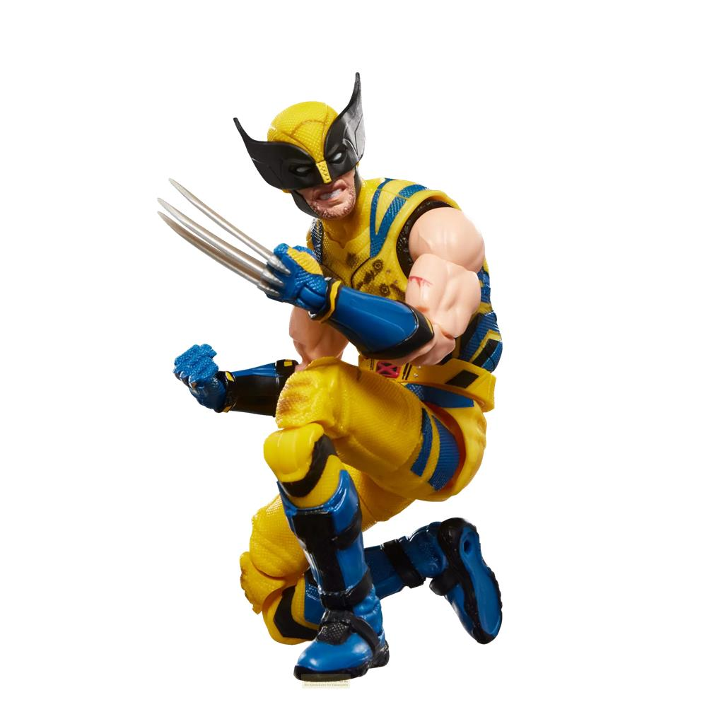 Figura de Wolverine con traje amarillo y azul arrodillada con garras fuera.