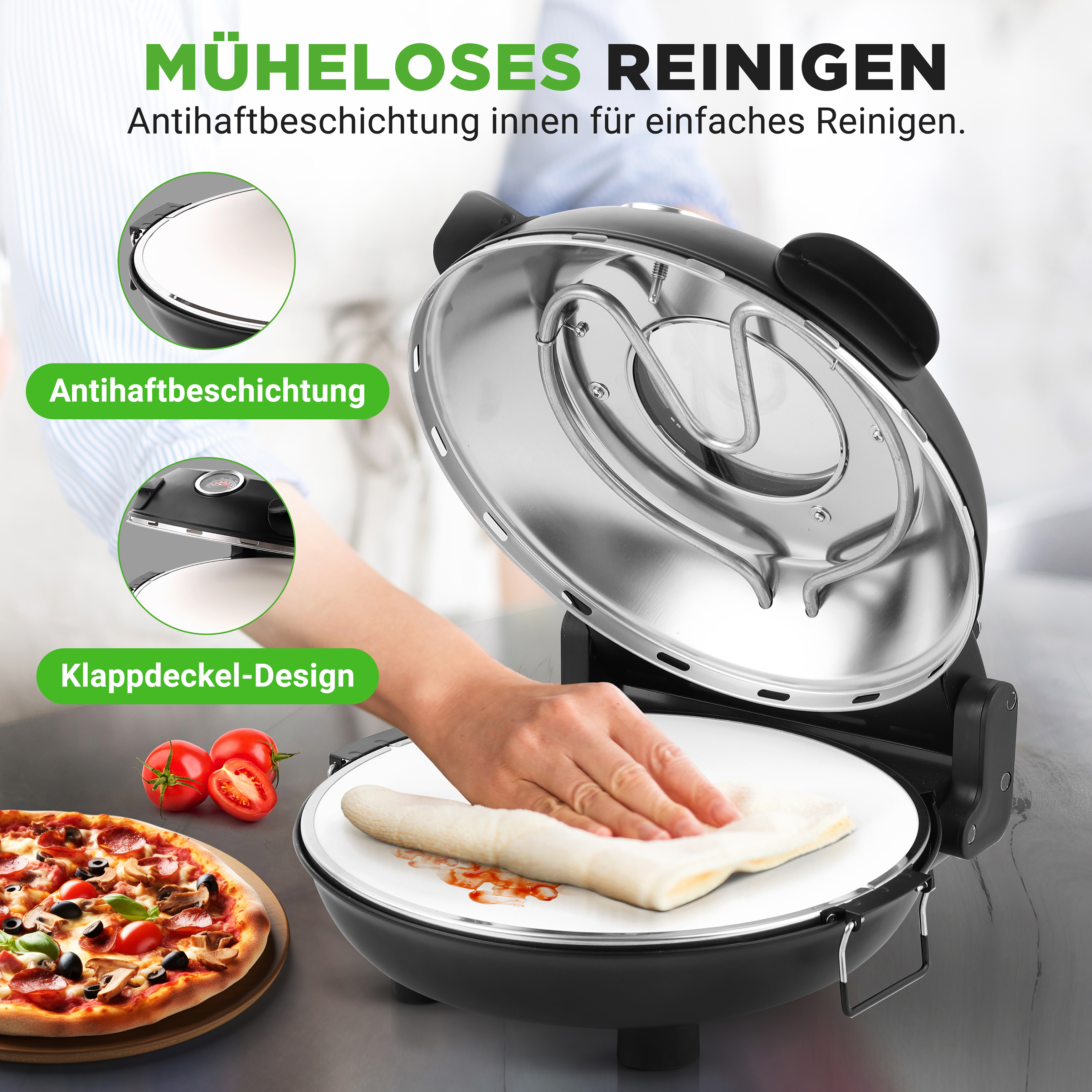 Eine Hand wischt den Innenraum eines offenen schwarzen Geräts mit Pizzabelägen und Tomaten daneben.