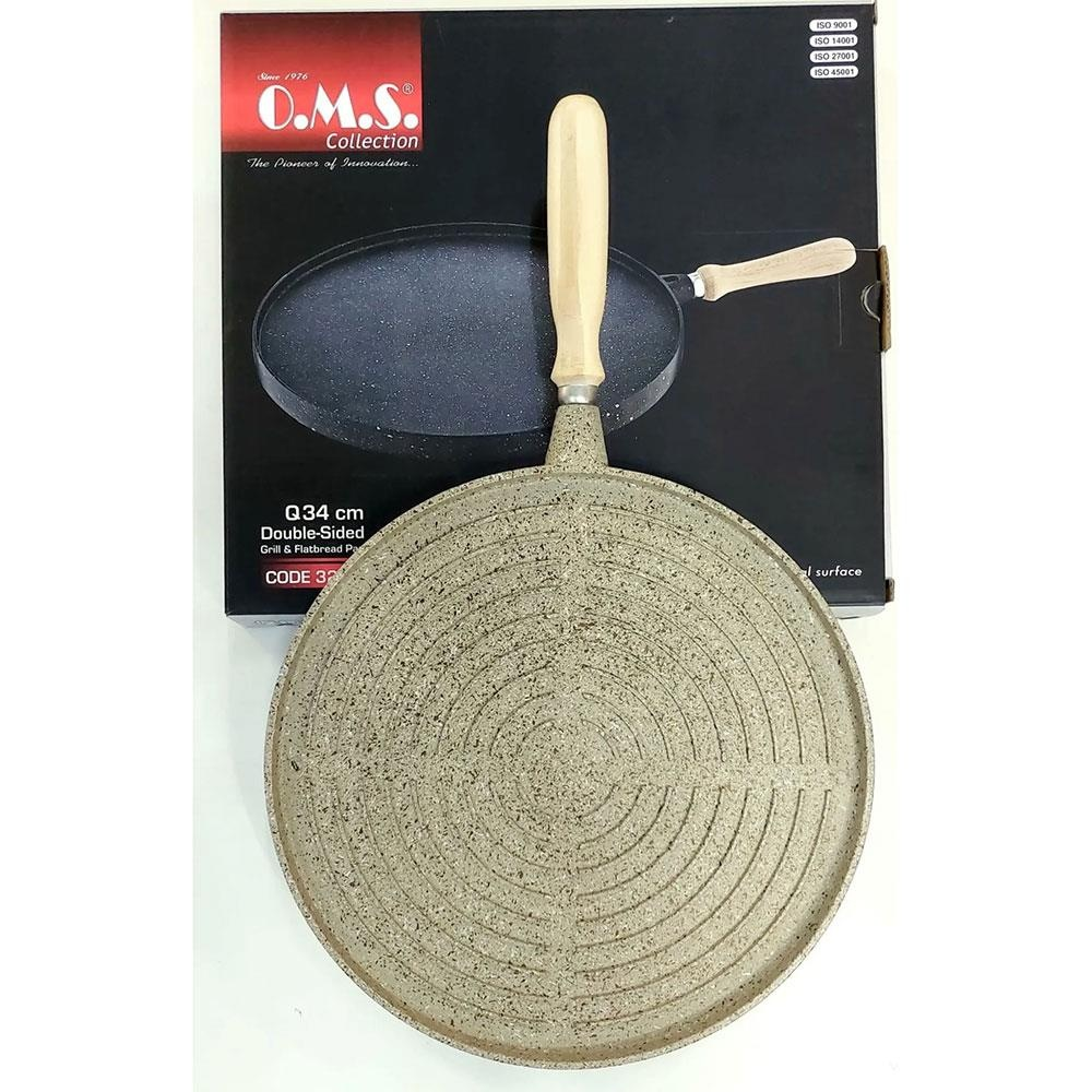 Ahşap saplı 34cm çift taraflı döküm ve pide tavası, kutusu üzerinde.