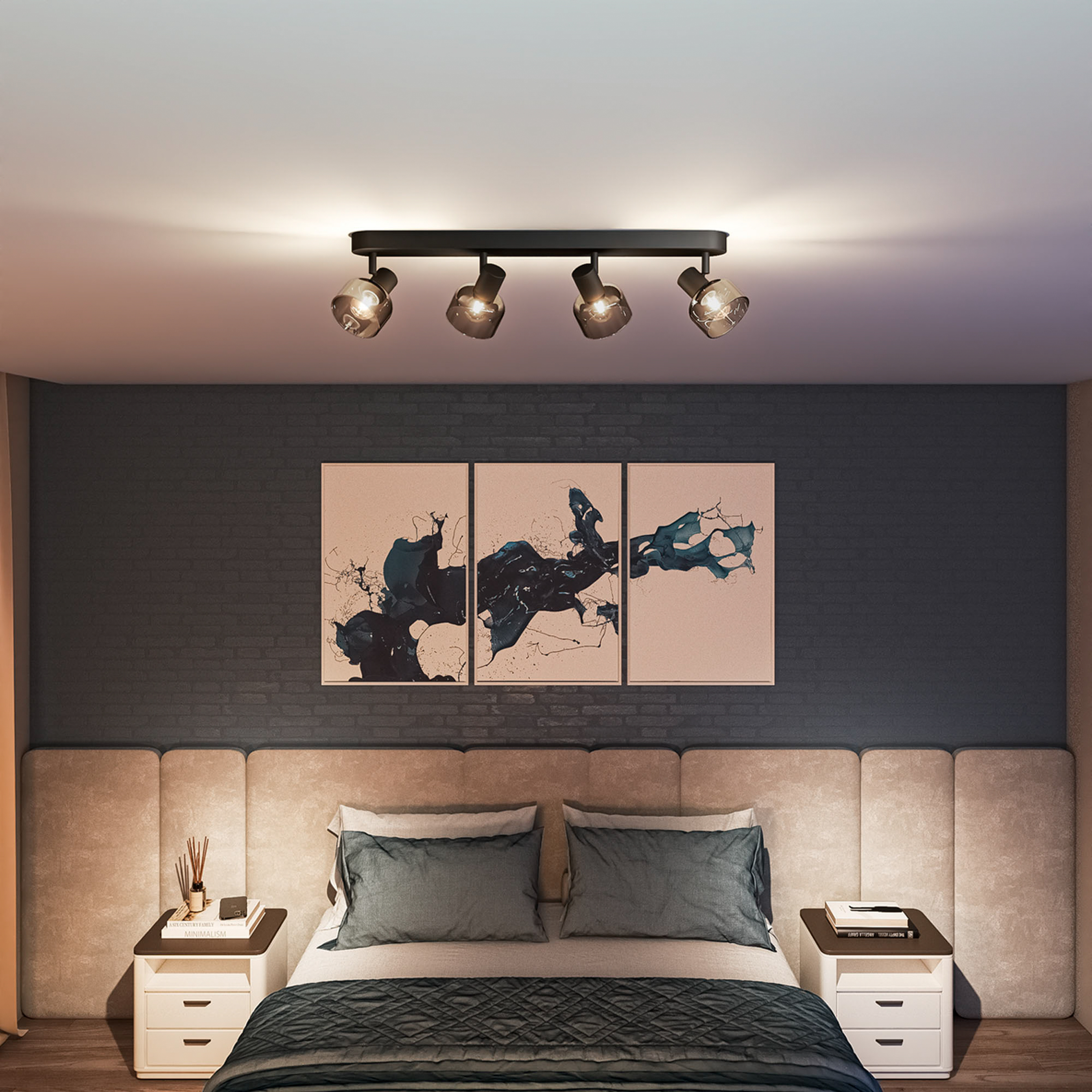 Ein Schlafzimmer mit einem Bett, drei Bildern und einem Deckenstrahler.
