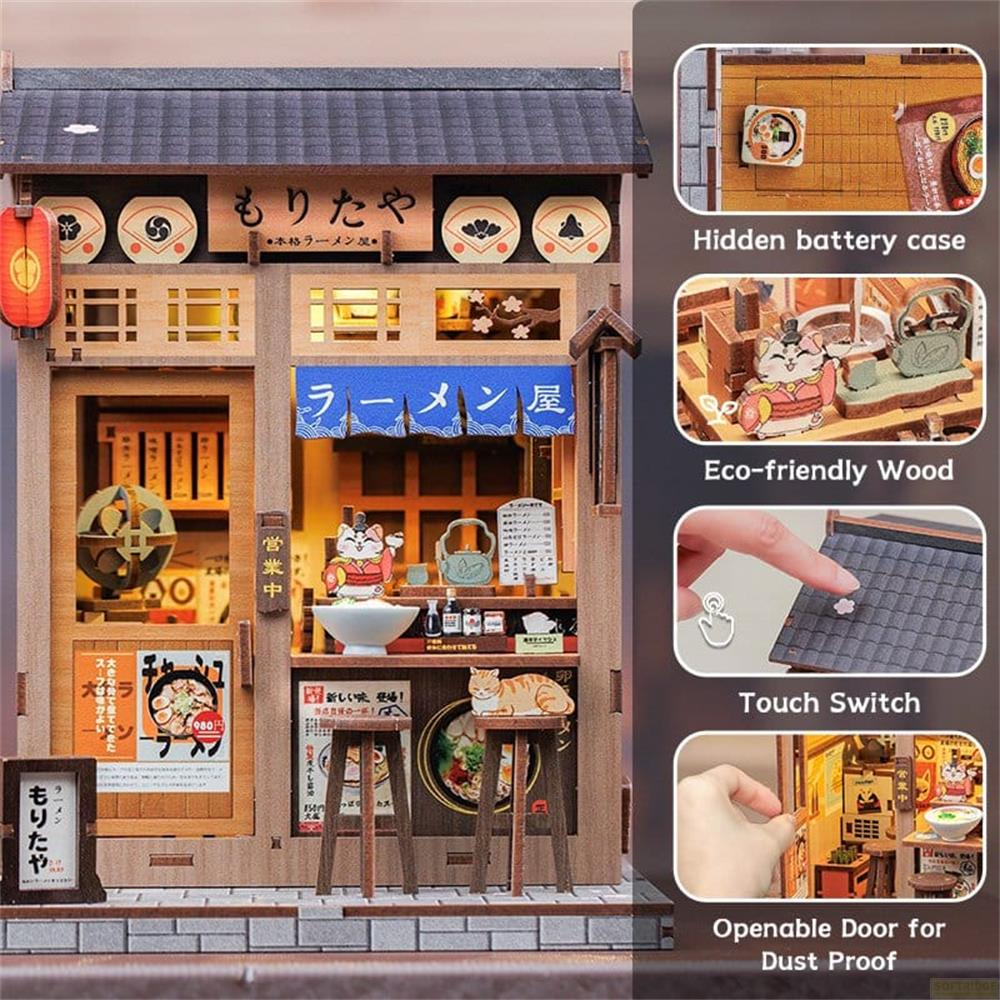 Modell eines japanischen Ramen-Ladens mit Katzenfiguren und vielen Details.