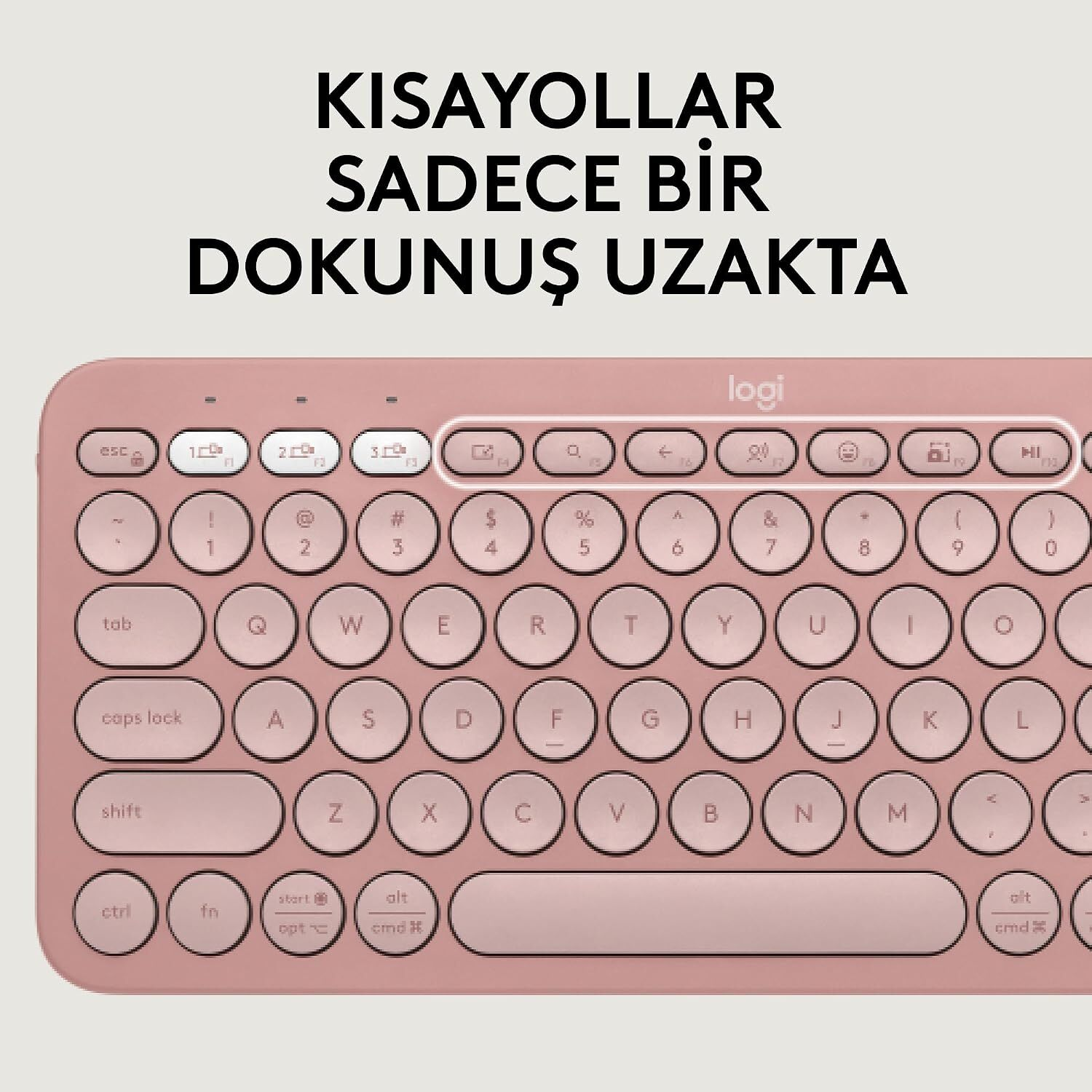 Logitech logosuna sahip, yuvarlak tuşlu pembe bir klavye.