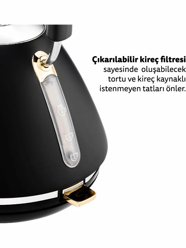 Altın aksanlı siyah elektrikli su ısıtıcısı ve su seviyesi göstergesi.
