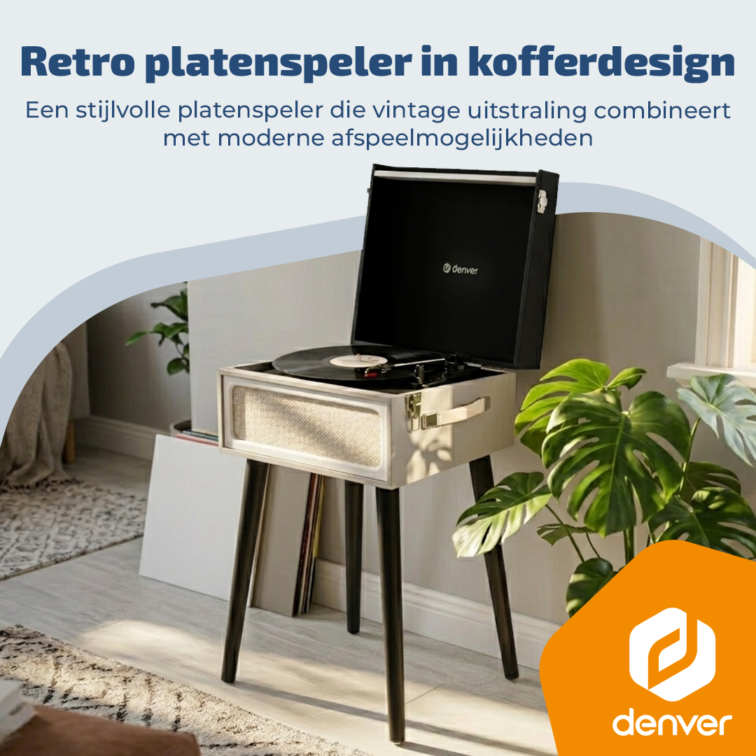 Retro gramofon w walizce z płytą winylową i roślinami.