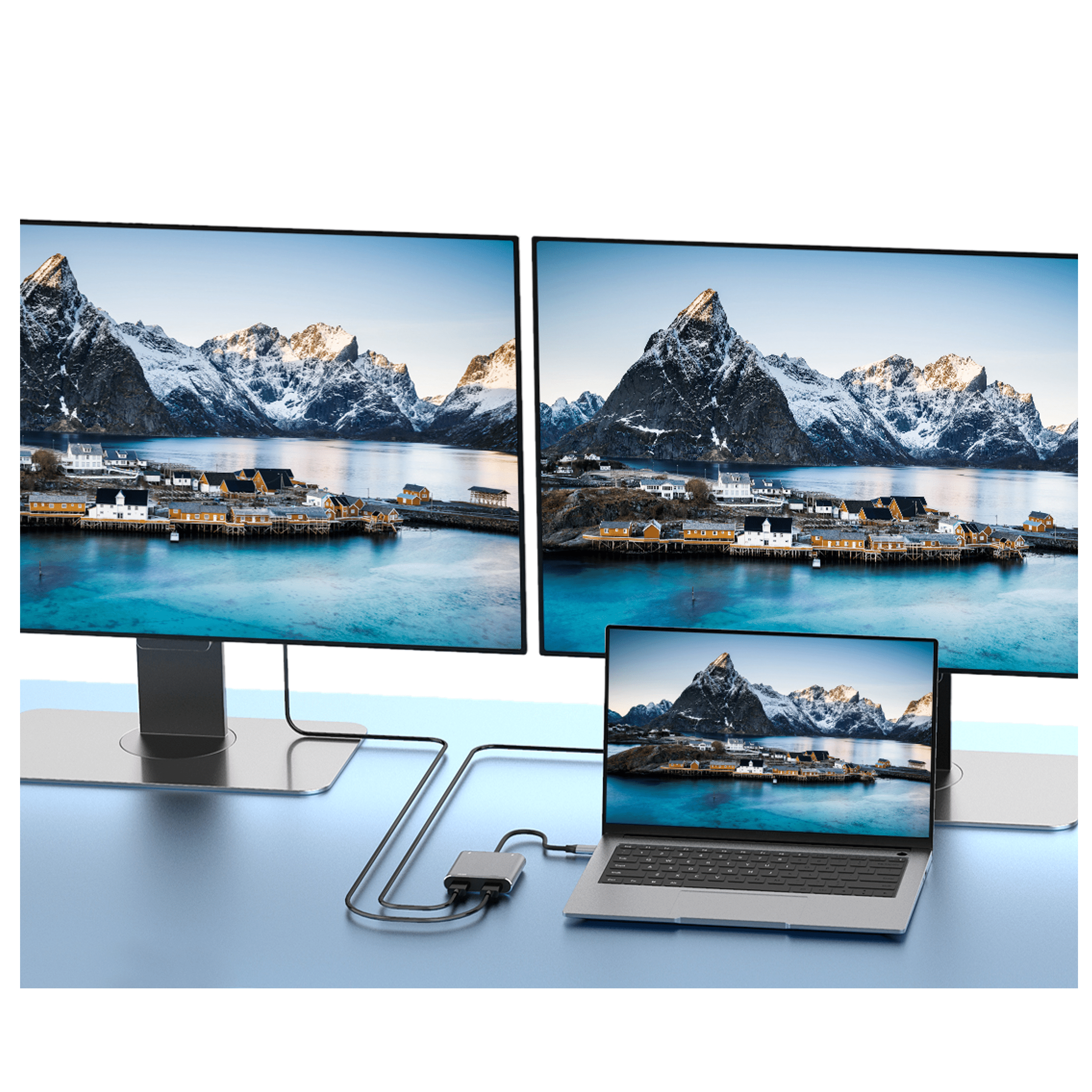 Laptop with three monitors displaying a mountain landscape, connected via a hub.