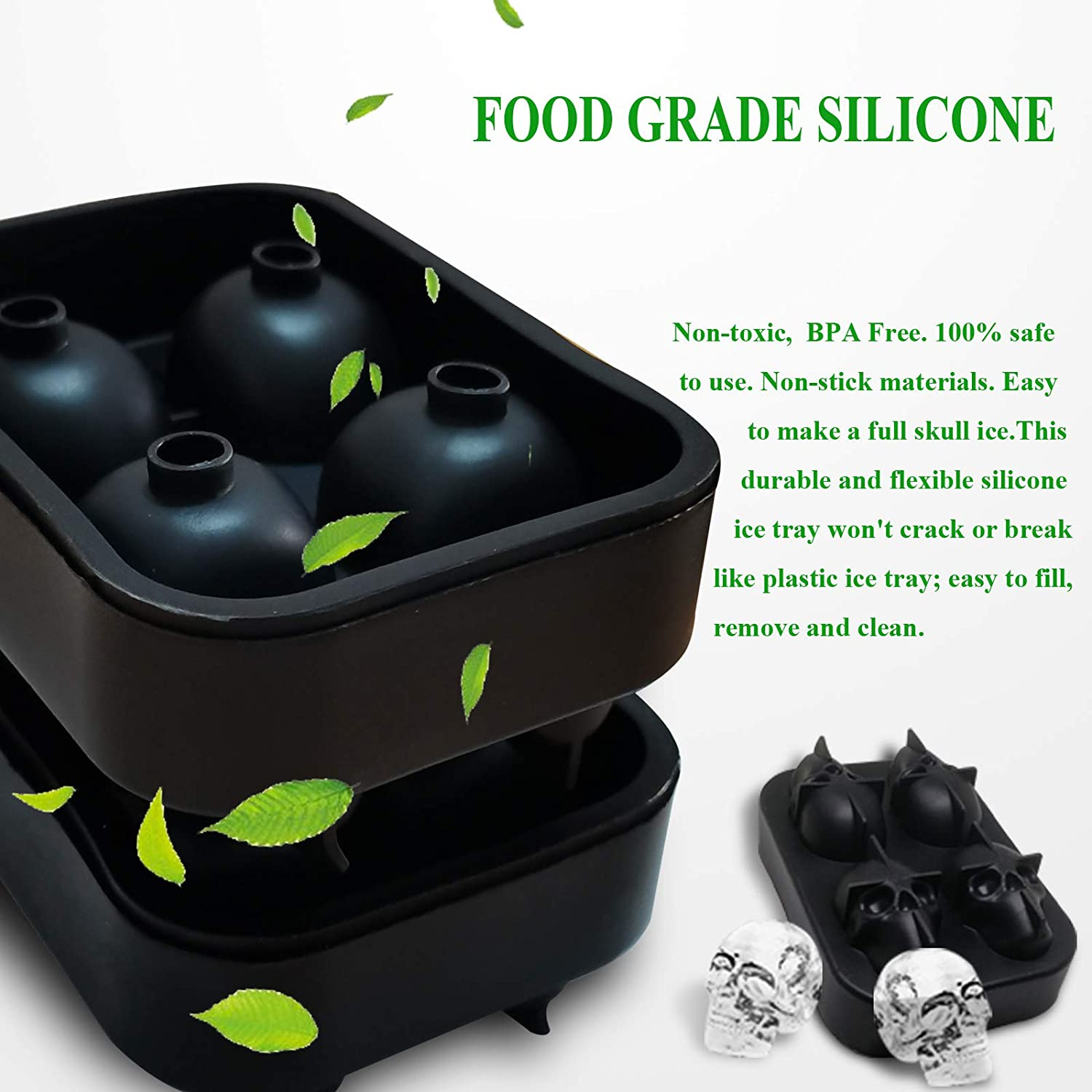 Schwarze Silikon-Eiswürfelformen für Schädel und Kugeln mit grünen Blättern.