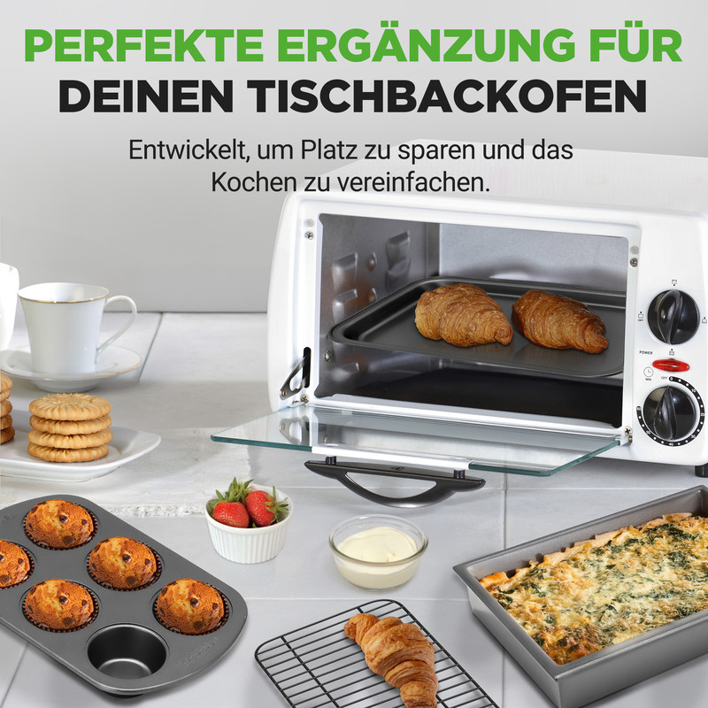 Ein Tischbackofen mit Gebäck, Muffins, Kuchen und Obst. Perfekt für die Küche.