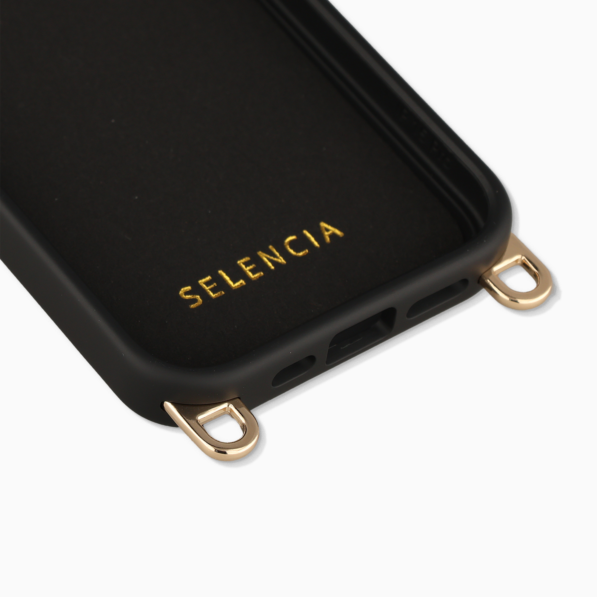 Coque noire pour téléphone avec lettrage doré SELENCIA et œillets dorés pour sangle.
