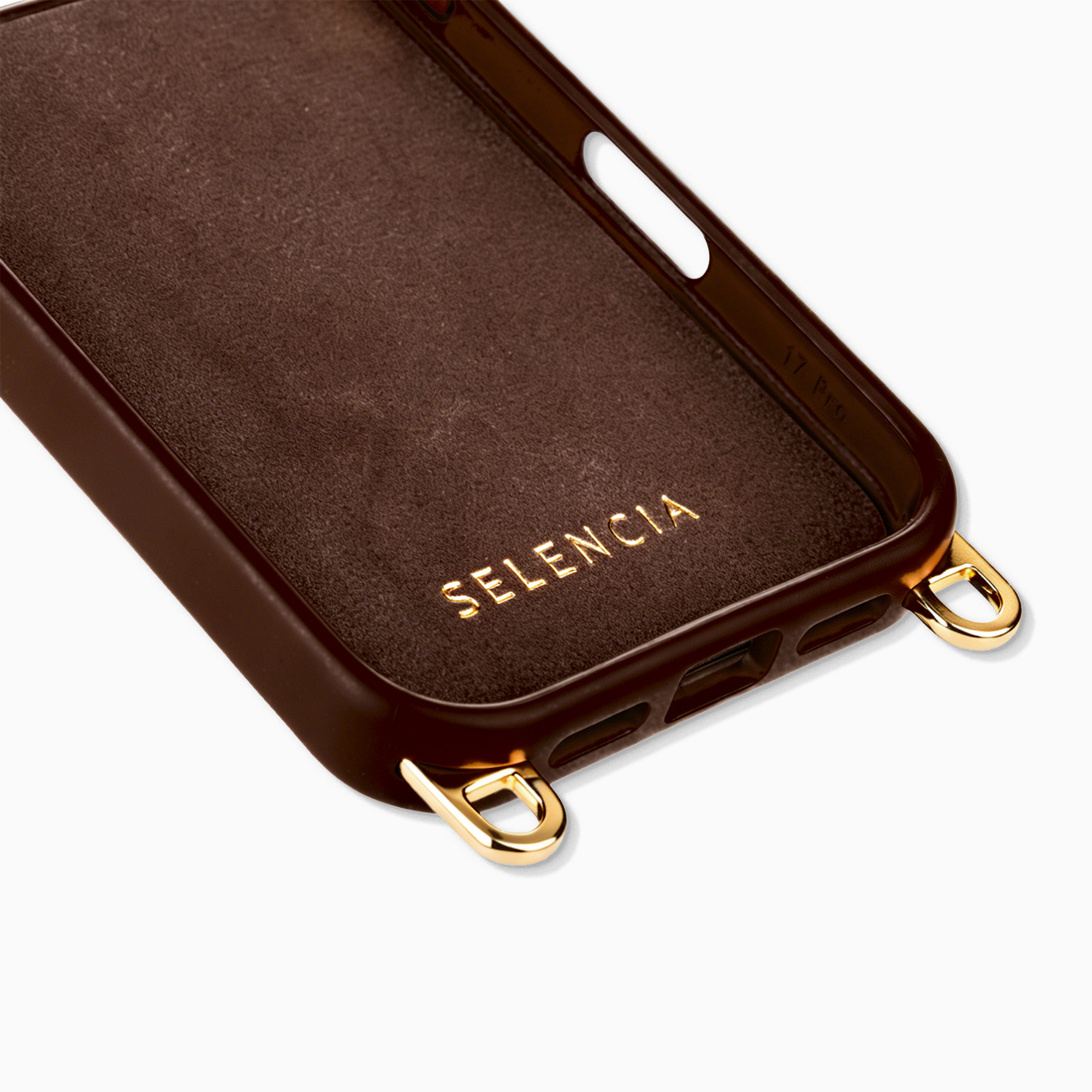 Bruine telefoonhoes binnenkant met gouden SELENCIA logo en gouden lussen.
