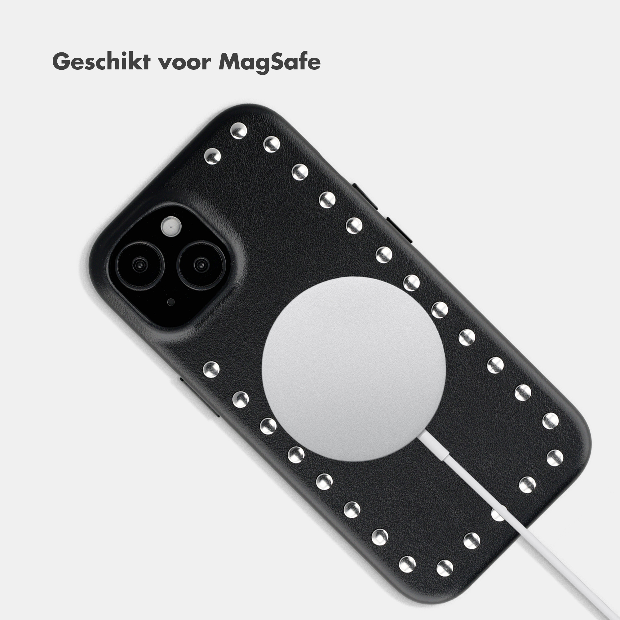 Black phone case with studs and MagSafe charger.