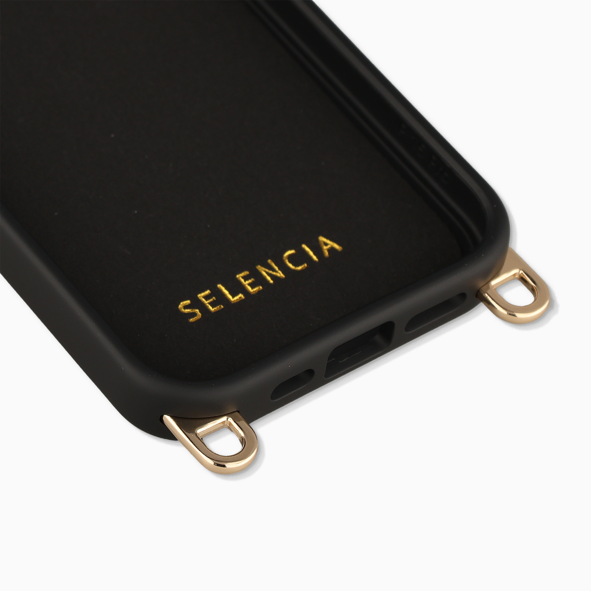 Coque de téléphone noire avec gaufrage doré et boucles de fixation.
