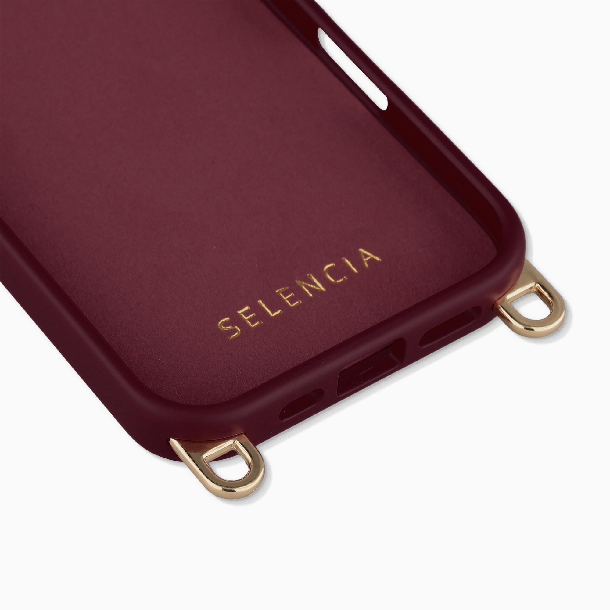 Funda de teléfono burdeos con ojales dorados y logo en relieve.