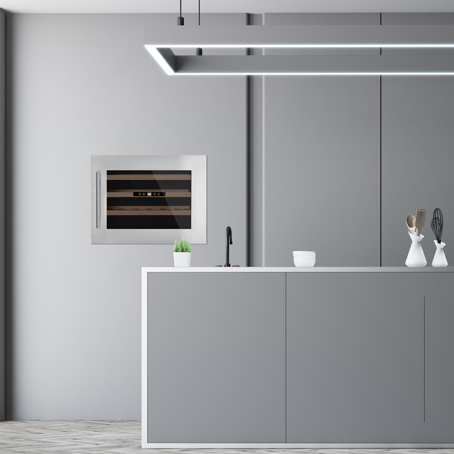 Una moderna area cucina grigia con cantinetta, lavello e mobili.