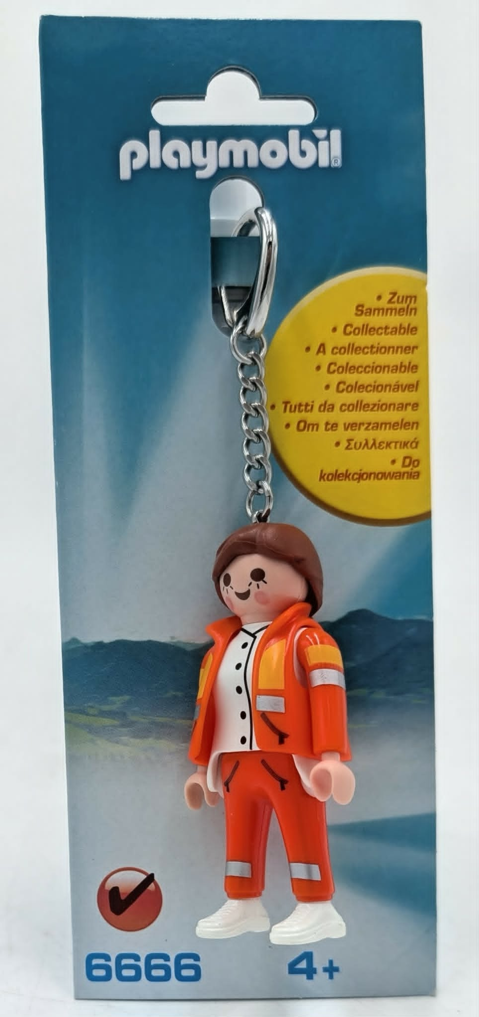 Portachiavi Playmobil con personaggio in abito arancione e anello portachiavi argentato su confezione.