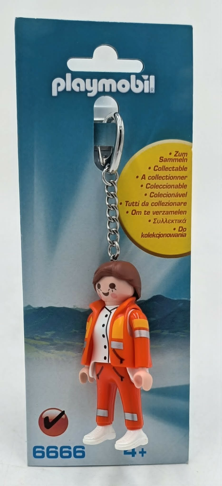 Portachiavi Playmobil con figura di vigile del fuoco in uniforme arancione su confezione.