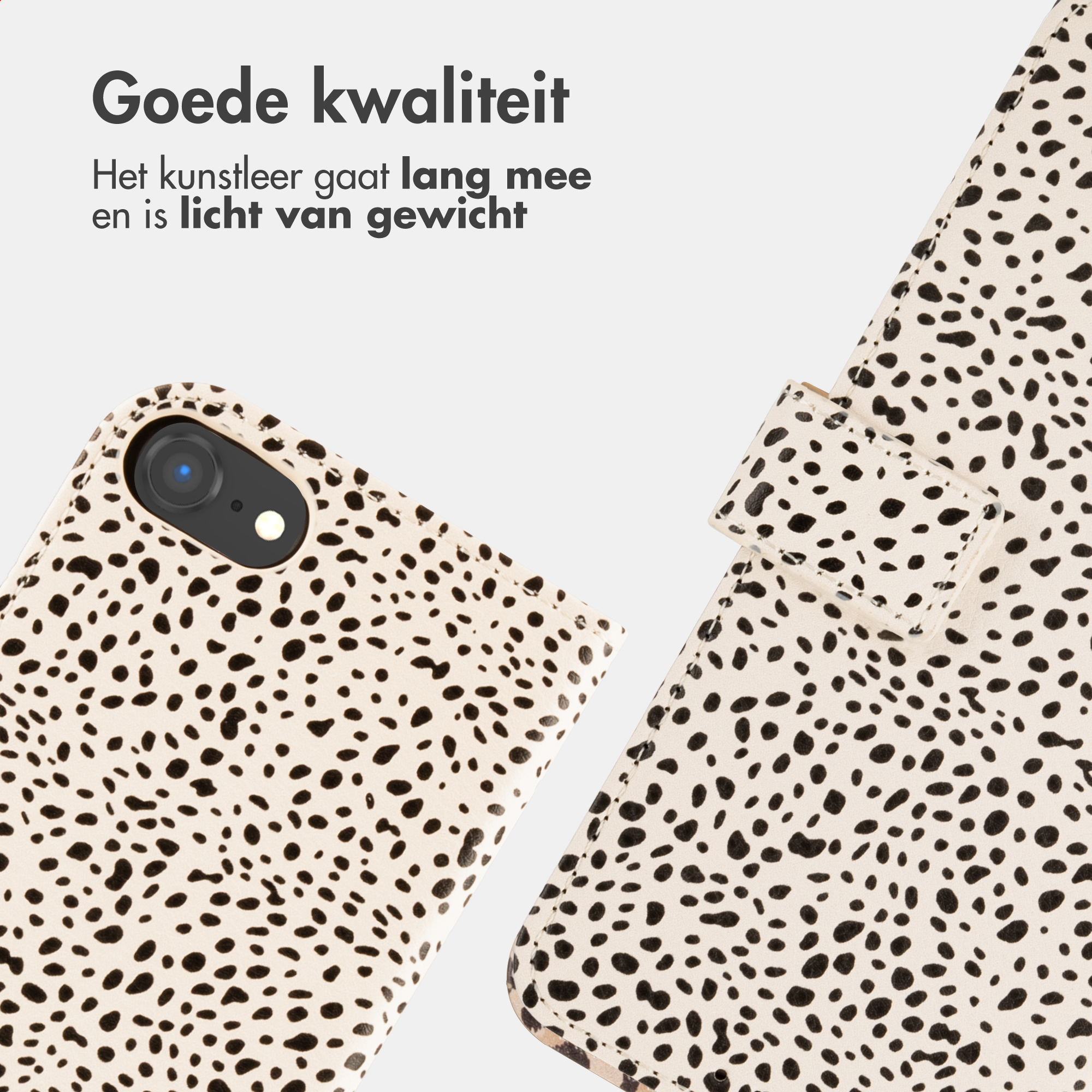 Una cover per telefono con stampa dalmata è accanto a un telefono.
