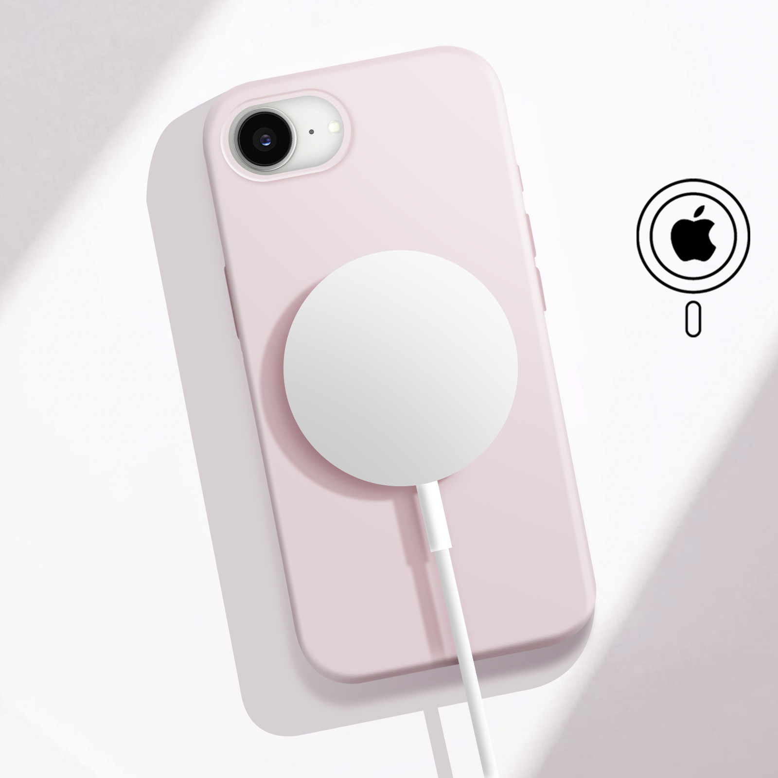 Un iPhone rosa con caricatore MagSafe e logo Apple.