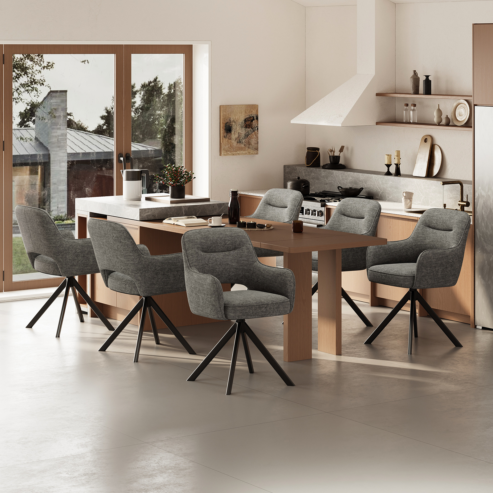 Set di sedie e tavolo grigi in una cucina moderna, con vista sull'esterno.