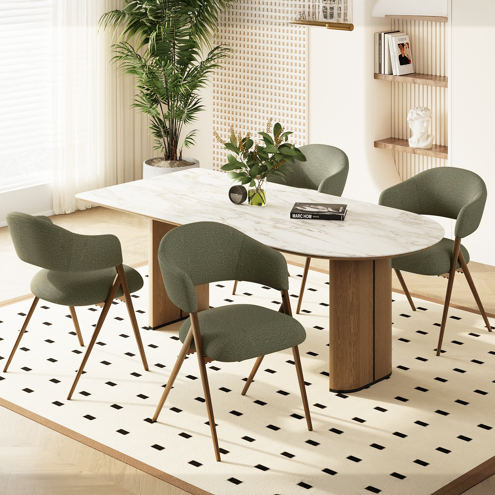 Un tavolo da pranzo con piano in marmo, quattro sedie verdi e una pianta.