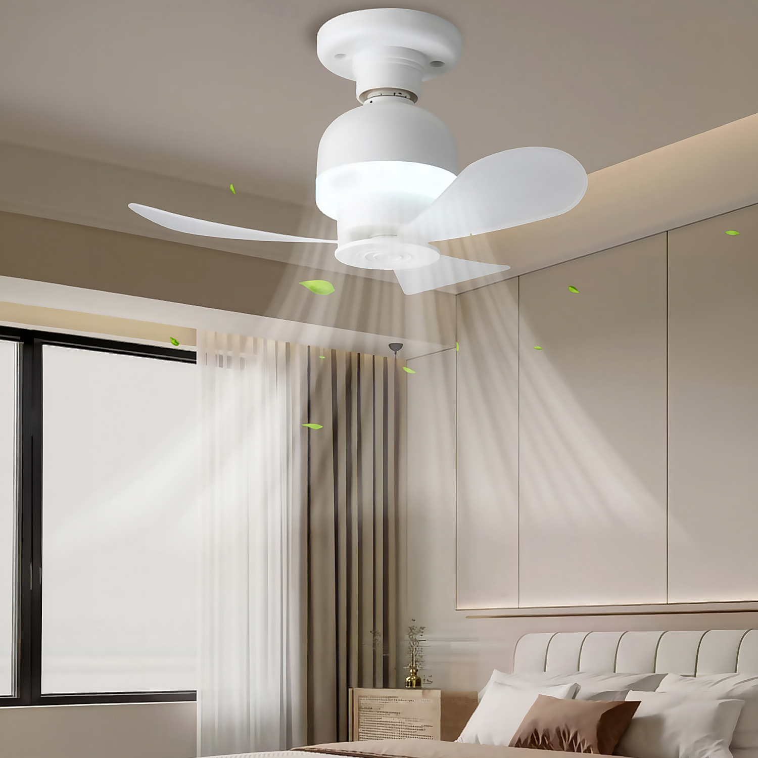 Ventilador de techo con luz y hojas flotando en un dormitorio.