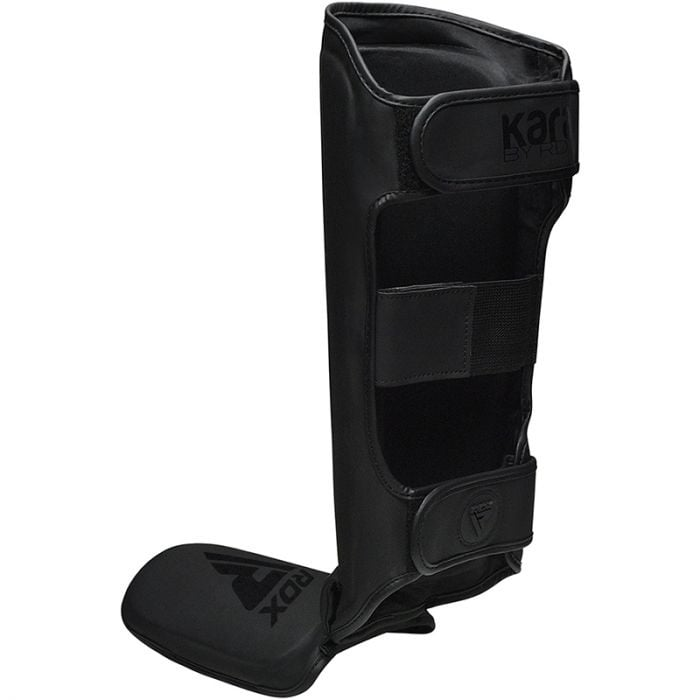 A black shin guard with velcro straps and logos.
