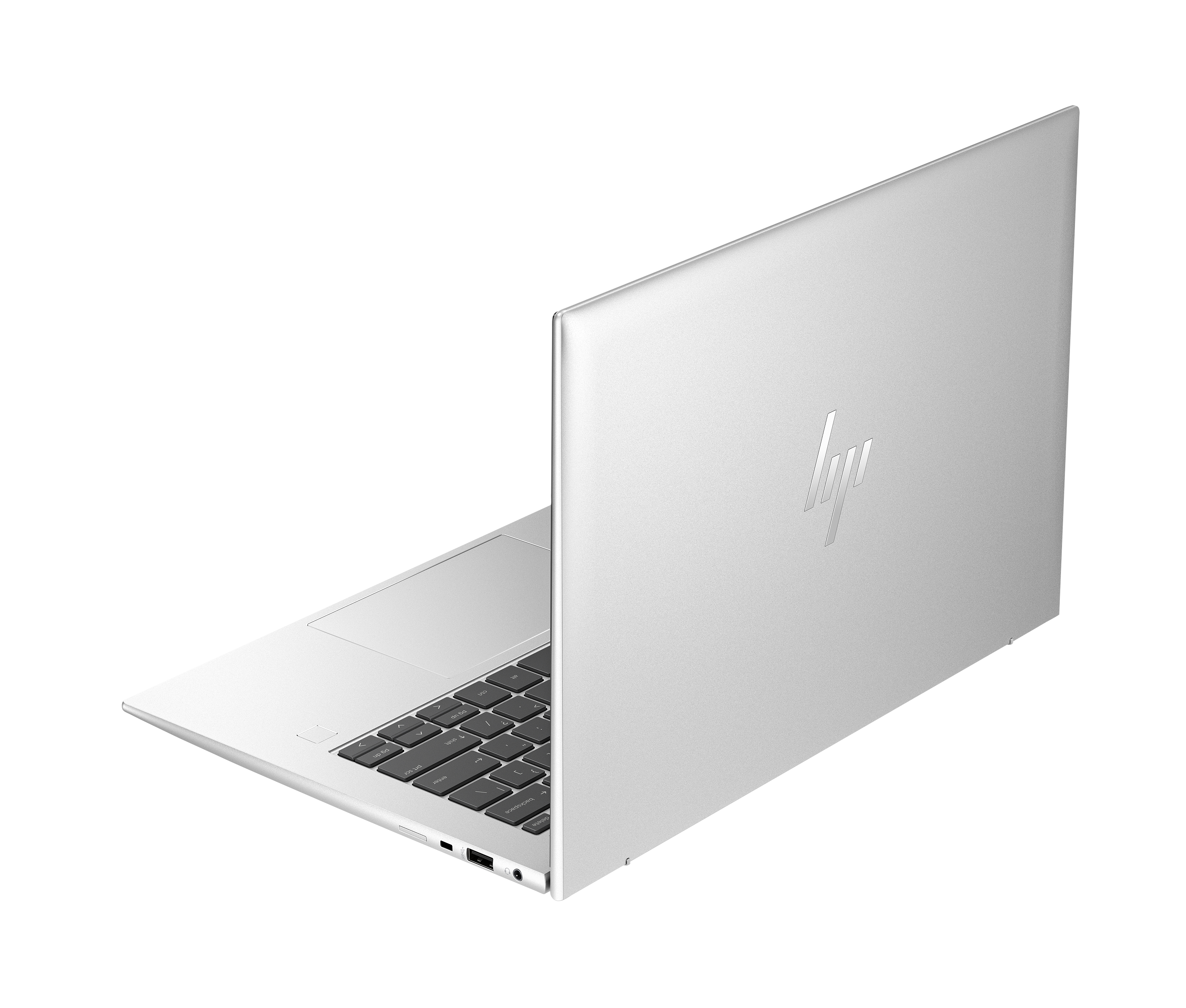 Srebrny laptop HP, widziany od tyłu z lewej strony, z podświetlaną klawiaturą.