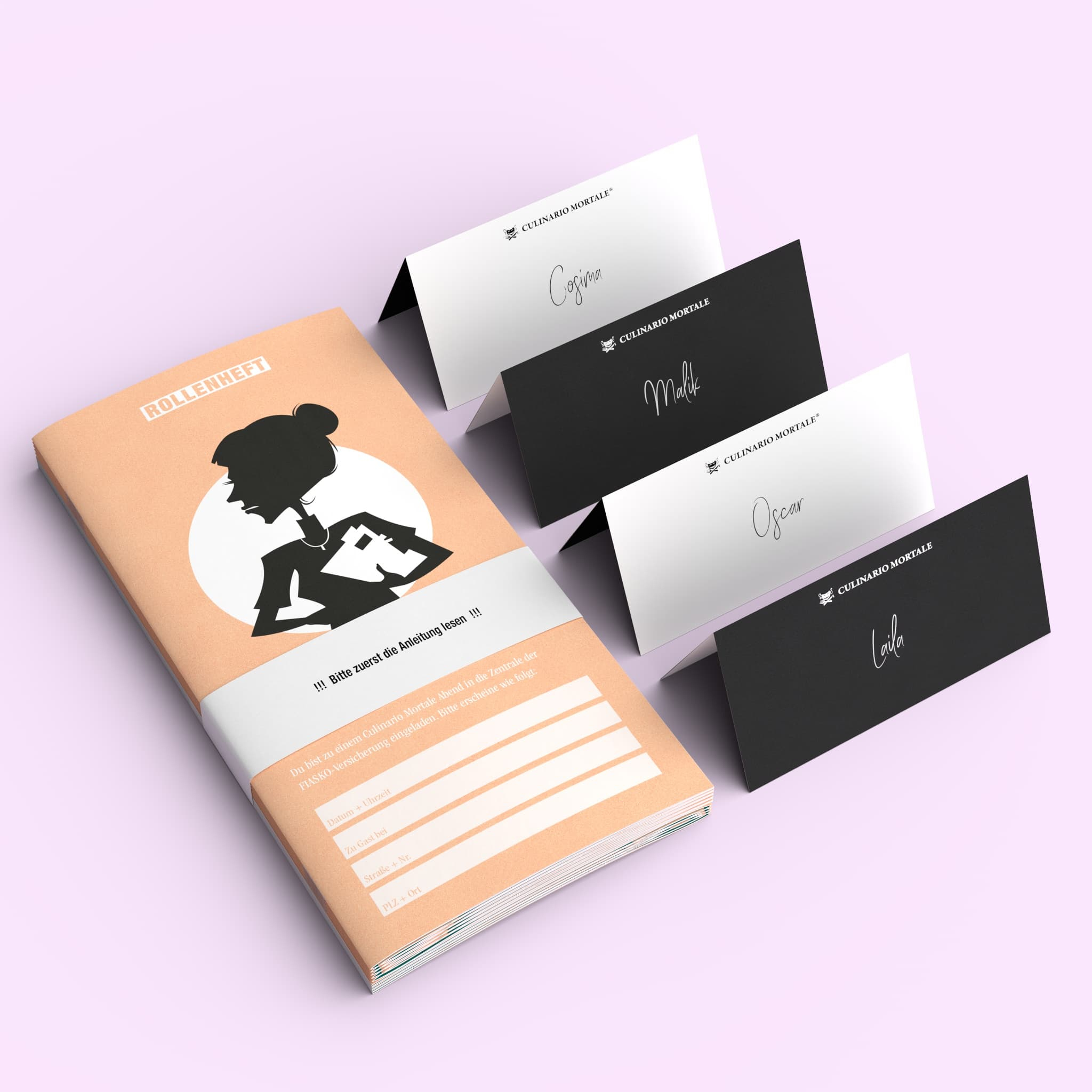 Ein orangefarbenes Notizbuch mit schwarzer Silhouette und drei bedruckten Tischkarten.