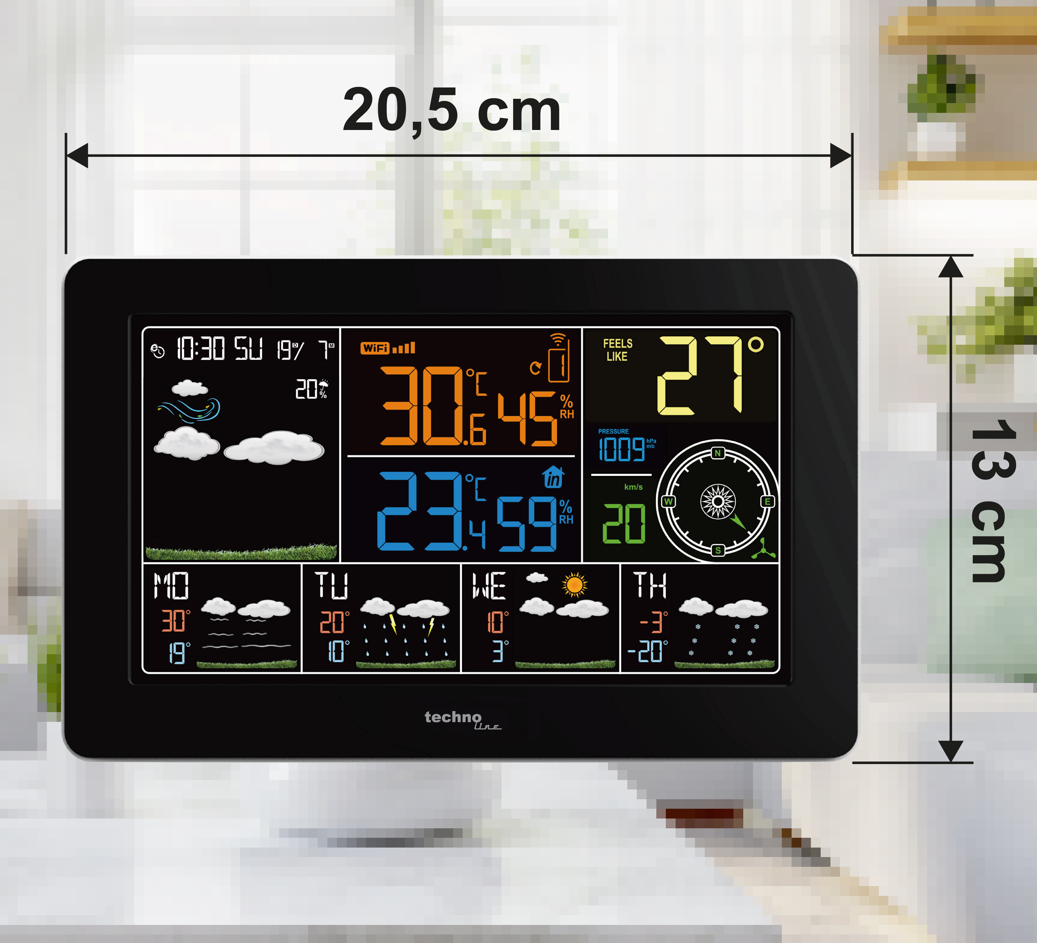 Digitalwetterstation zeigt Temperatur, Luftfeuchtigkeit, Druck und Windgeschwindigkeit.