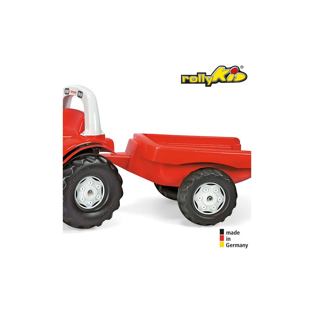 Tracteur jouet rouge avec remorque, arceau blanc, roues noires. Fabriqué en Allemagne.