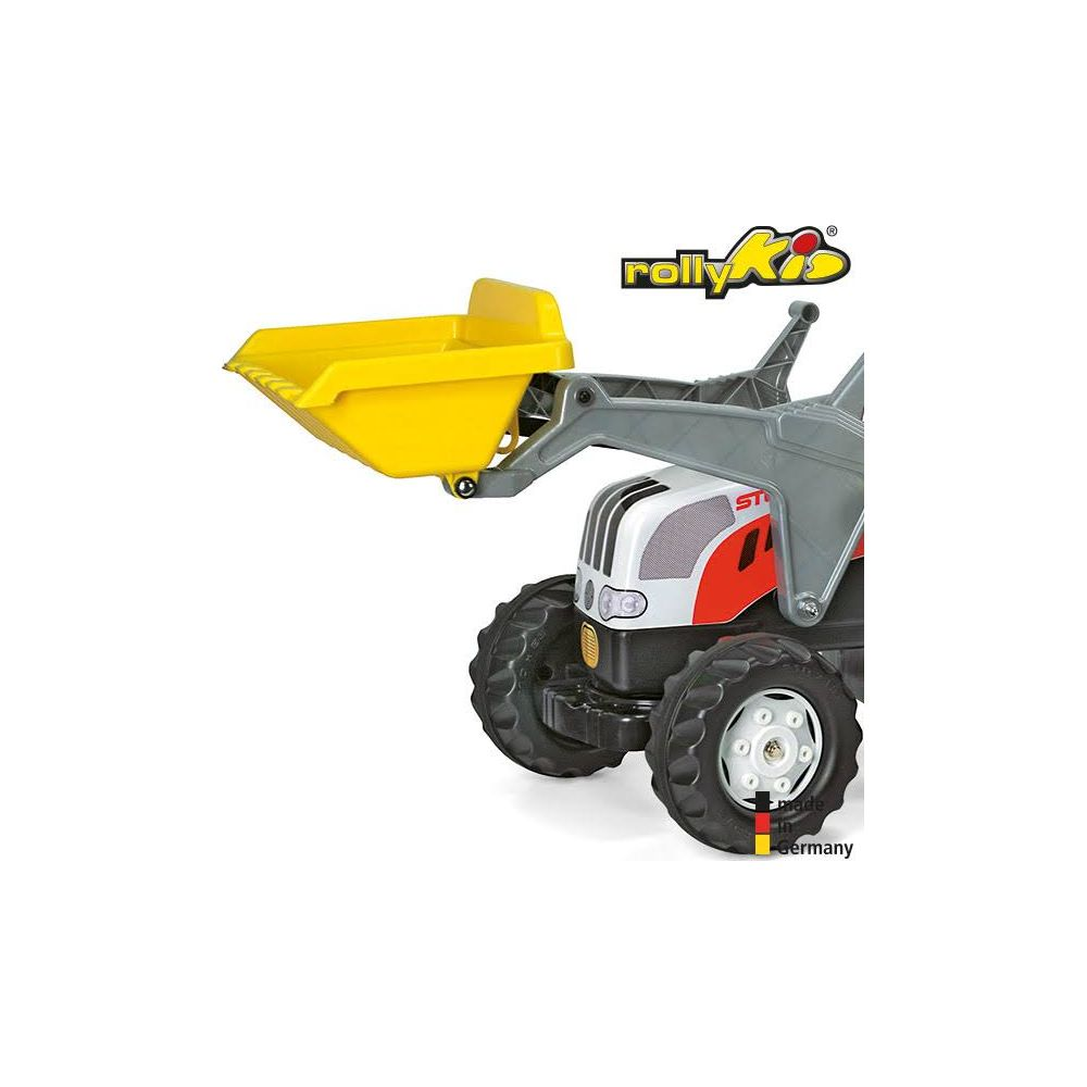 Un chargeur jaune sur un tracteur jouet avec le logo "rollyKid".
