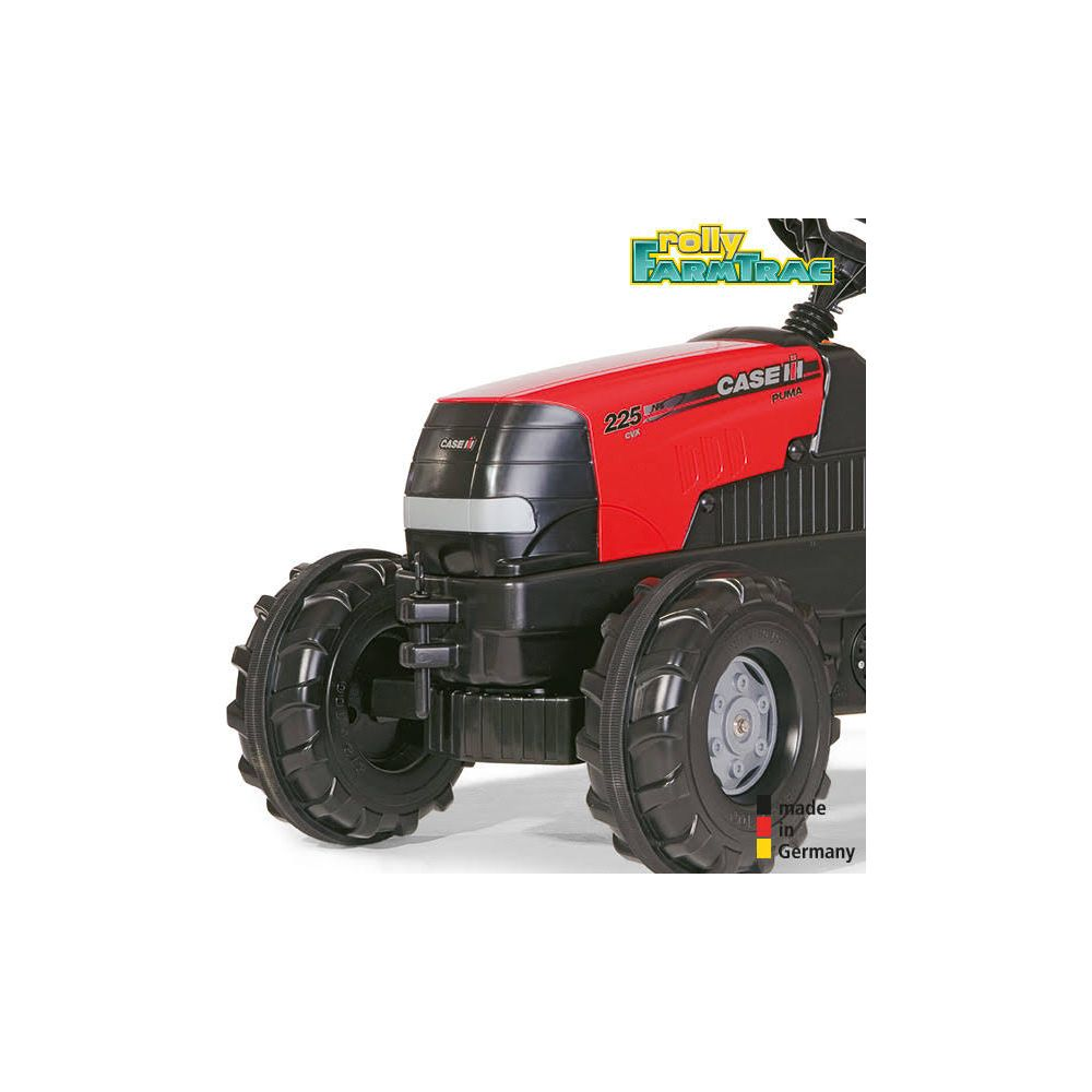 Ein roter Spielzeugtraktor mit großen schwarzen Reifen und "CASE IH" Aufschrift.