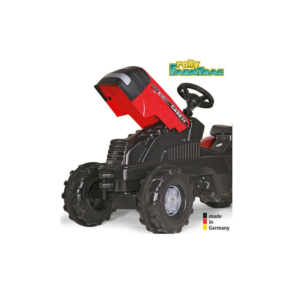 Ein schwarzer und roter Trettraktor Spielzeug mit Lenkrad und großen Rädern.