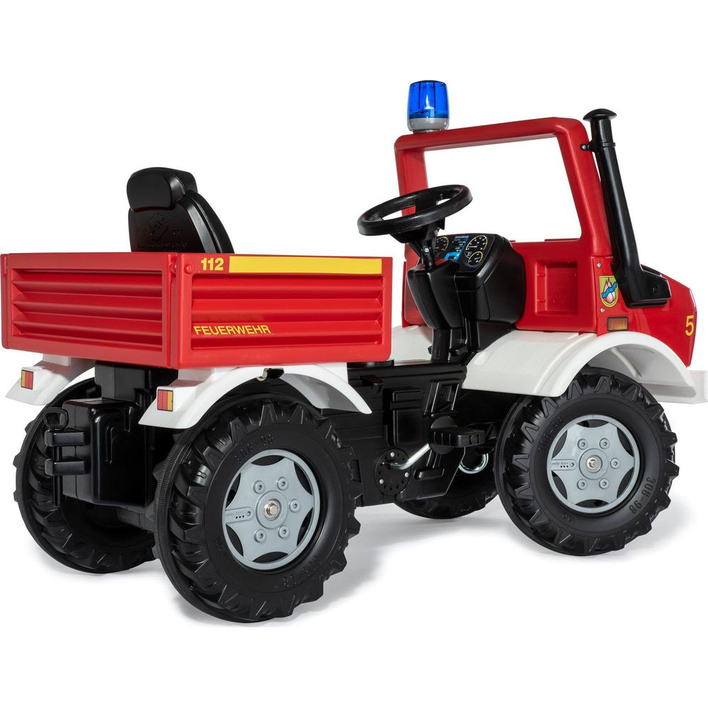 Un tracteur rouge de camion de pompiers jouet avec une lumière bleue et le numéro 112.