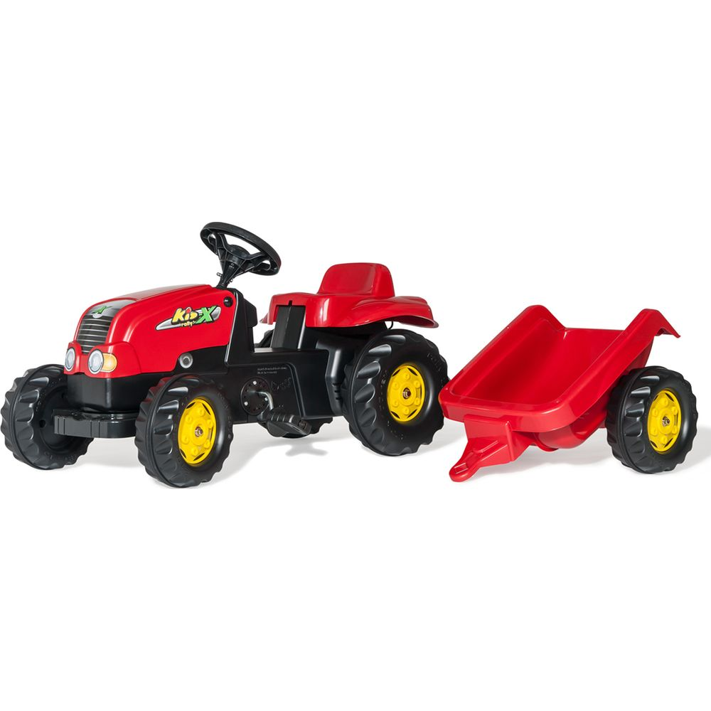 Ein roter Spielzeugtraktor mit Anhänger und gelben Felgen.