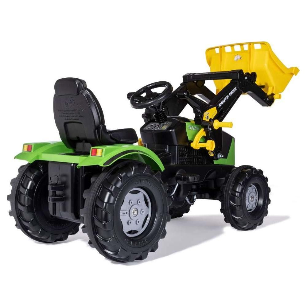 Ein grüner Spielzeugtraktor mit gelber Ladeschaufel und schwarzem Sitz.