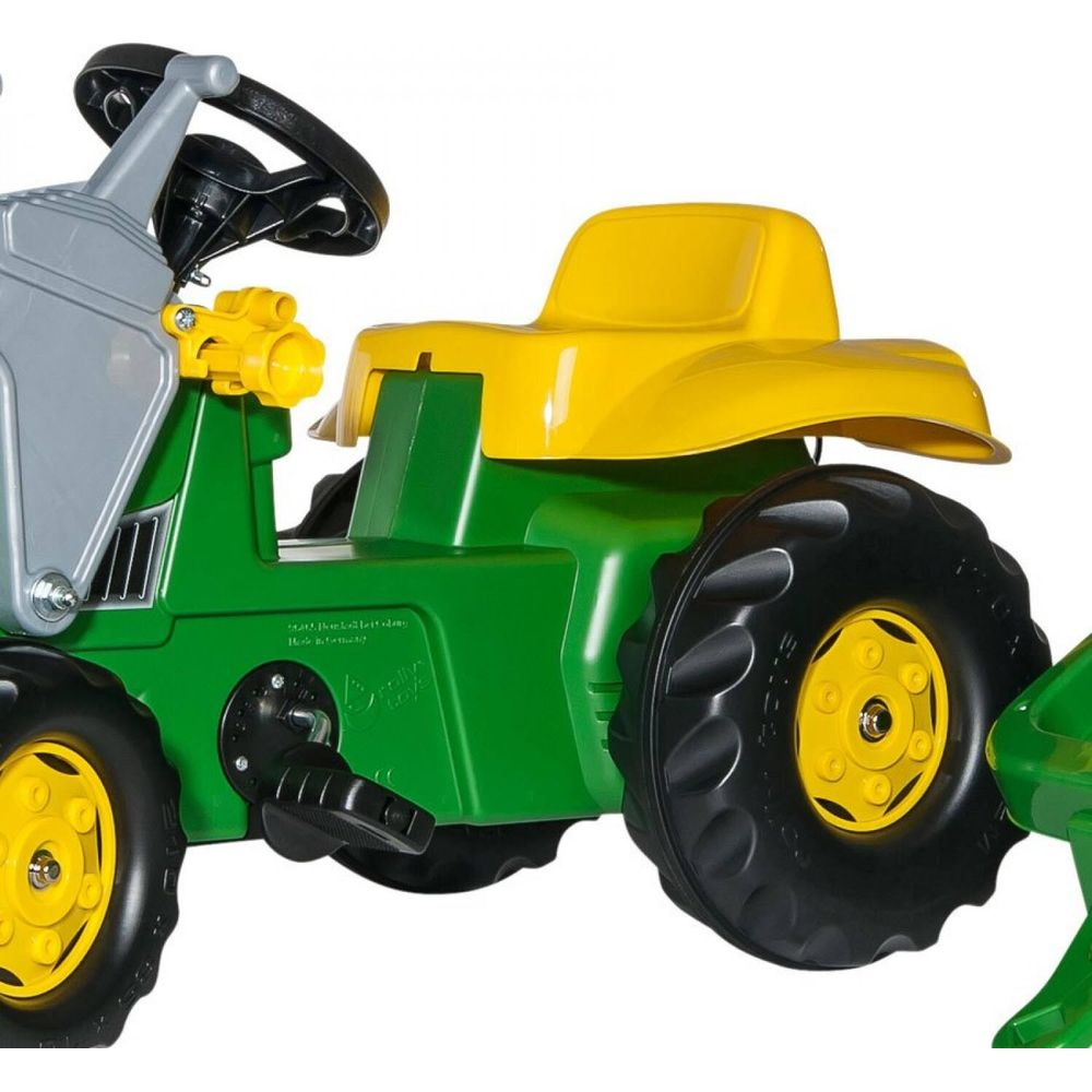 Grüner und gelber Spielzeugtraktor mit großem schwarzem Rad und Lenkrad.