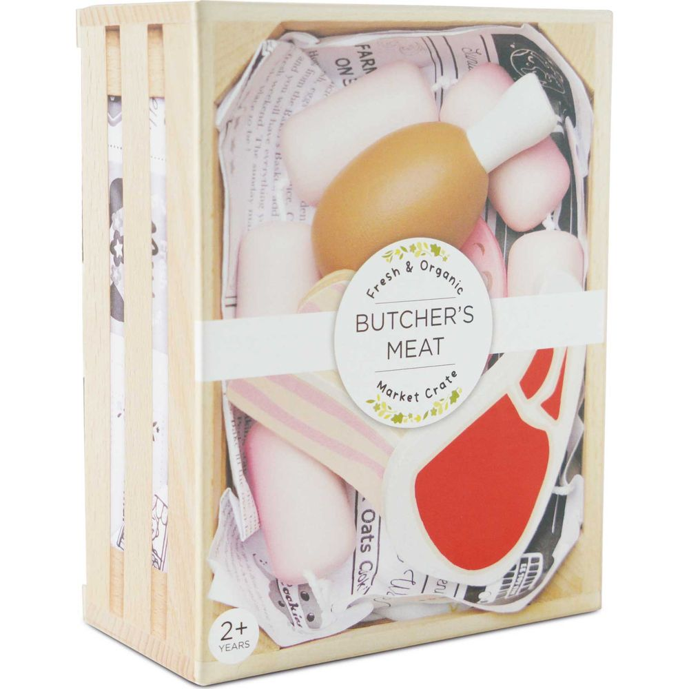 Holzkiste mit Spielzeugfleisch, Ei und Zeitungspapier.