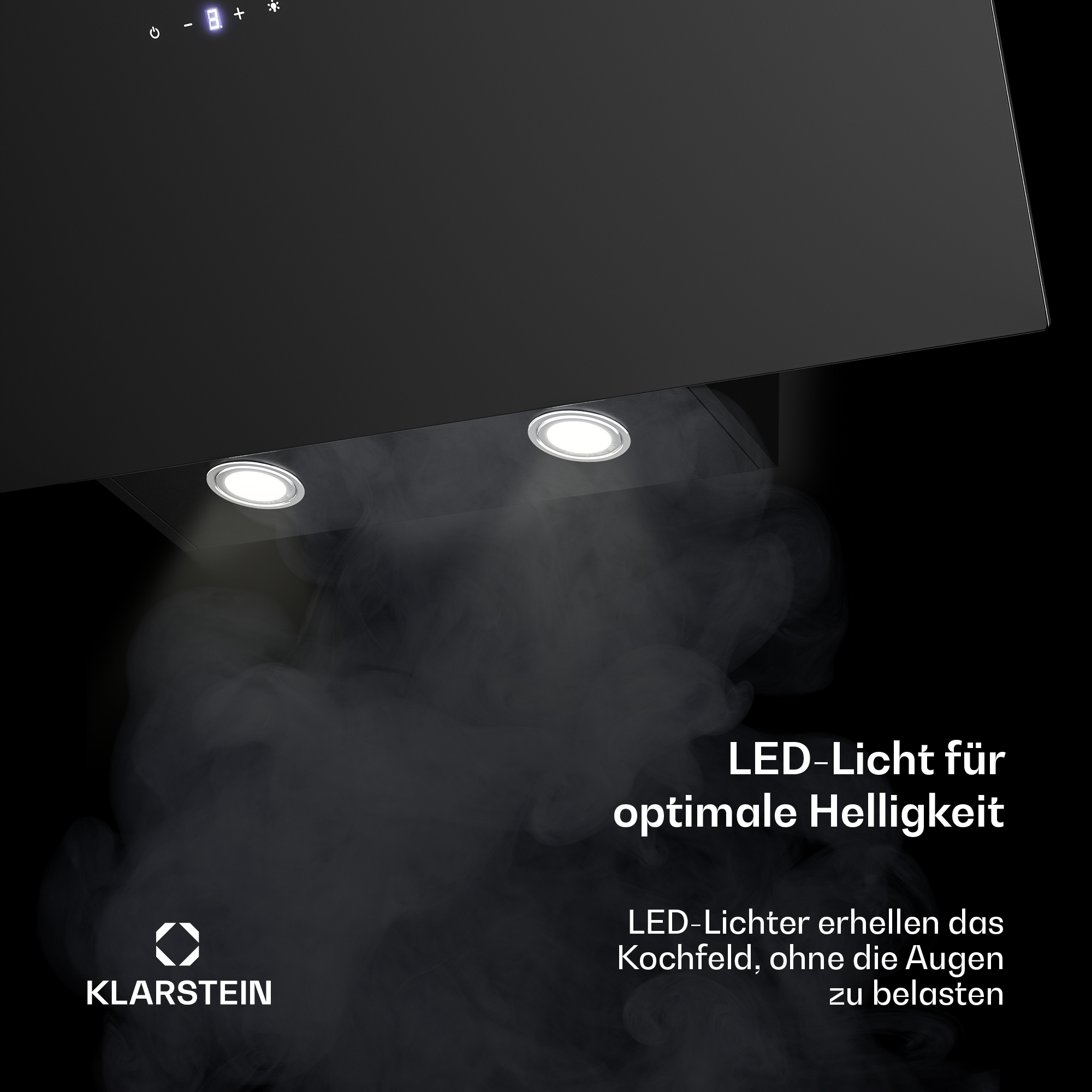 Dunstabzugshaube mit LED-Beleuchtung und Rauch im Vordergrund.