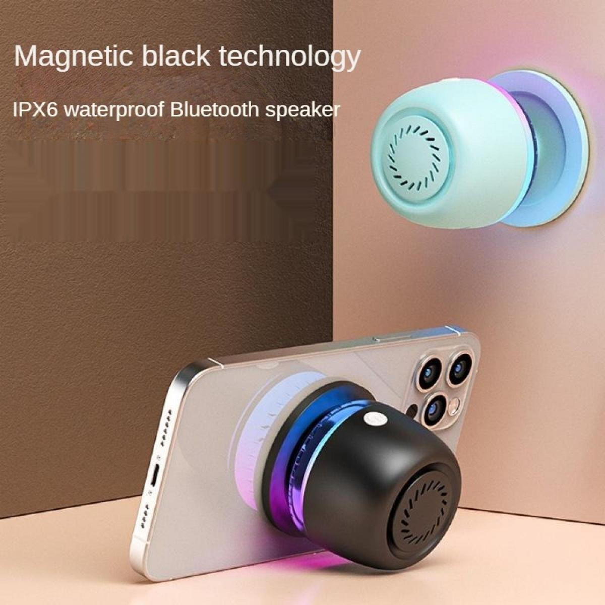 Ein schwarzer magnetischer Bluetooth-Lautsprecher wird an einem Telefon befestigt. Ein weiterer Lautsprecher ist an einer Wand.