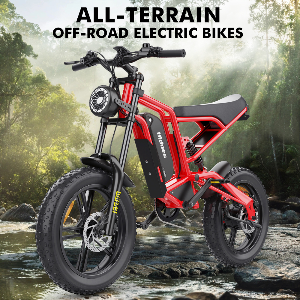 Una bicicleta eléctrica todoterreno roja junto a un río en un entorno boscoso.