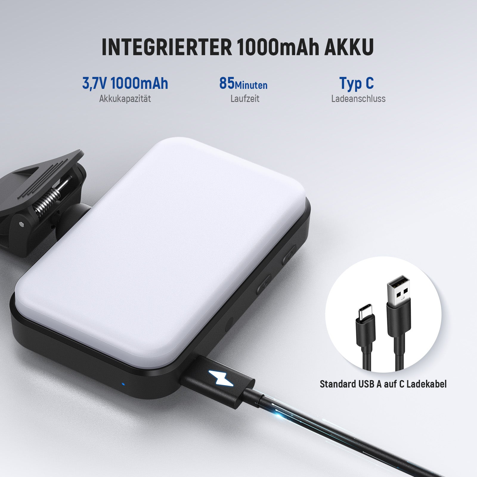 Ein schwarzes Ladegehäuse mit weißer Oberseite, angeschlossen an ein USB-C-Kabel.